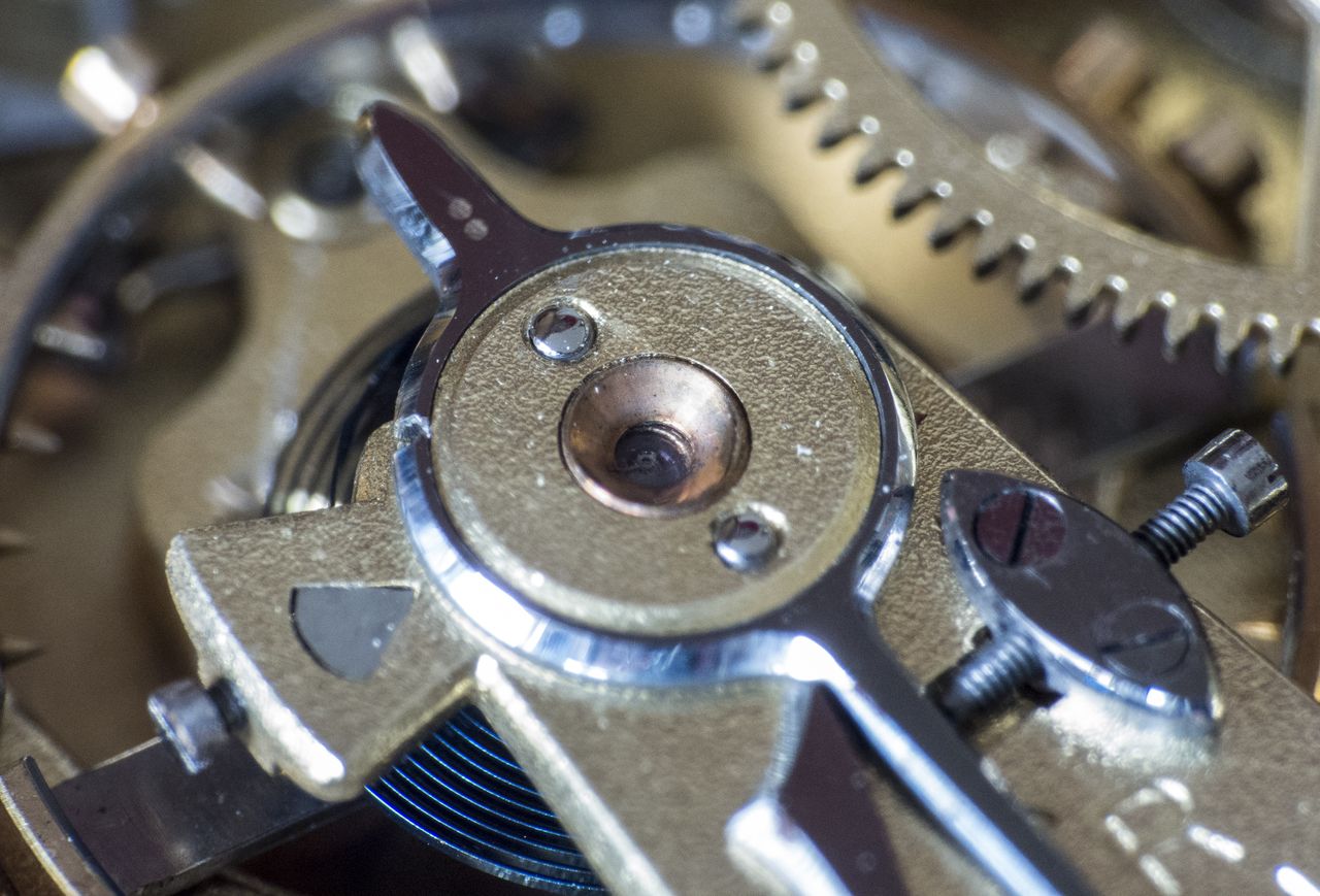 Close-up of a watch movement and gears that affect its value